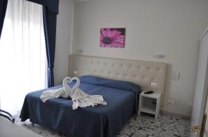Postel nebo postele na pokoji v ubytování Hotel Caribe