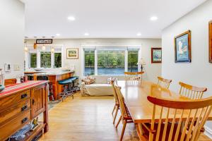 a kitchen and living room with a table and chairs at Riverside Bliss in Chestertown