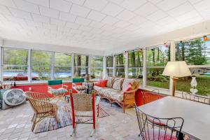 a living room with a couch and a table at Riverside Bliss in Chestertown