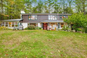 a house with a large yard in front of it at Riverside Bliss in Chestertown
