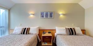 Postel nebo postele na pokoji v ubytování Dunedin Leisure Lodge - Distinction