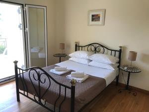 Ένα ή περισσότερα κρεβάτια σε δωμάτιο στο Villa Nino
