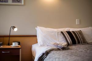 Postel nebo postele na pokoji v ubytování Dunedin Leisure Lodge - Distinction
