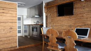 A kitchen or kitchenette at Chalet Swiss Andermatt
