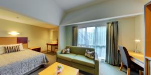 Postel nebo postele na pokoji v ubytování Dunedin Leisure Lodge - Distinction