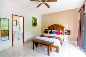 A bed or beds in a room at Downtown Suites