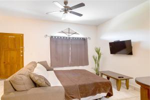 A bed or beds in a room at Downtown Suites