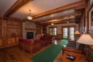 a living room filled with furniture and a fireplace at *APRES SKI LODGE, SKI IN-SKI OUT, CENTRAL VILLAGE! in Snowshoe