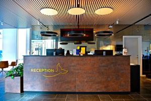 a reception area of a restaurant with a reception desk at Best Western Plus Hotel Ilulissat in Ilulissat