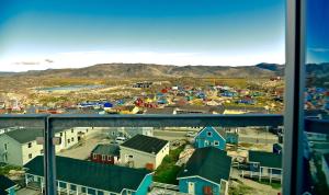 a view of a small town from a window at Best Western Plus Hotel Ilulissat in Ilulissat