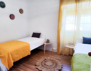 Ένα ή περισσότερα κρεβάτια σε δωμάτιο στο Lisboa92