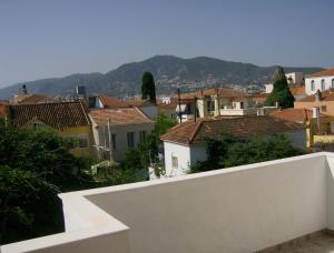 a view of a city with houses and mountains at Vazakas Rooms in Mytilene