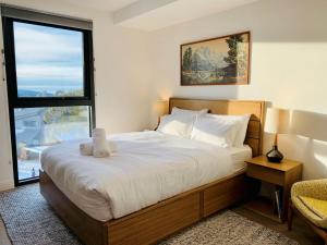 
A bed or beds in a room at Buller Holidays Apartments
