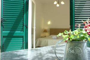 Posteľ alebo postele v izbe v ubytovaní Medulić Palace Rooms & Apartments