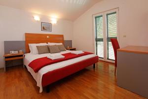 Postel nebo postele na pokoji v ubytování Apartments Vala