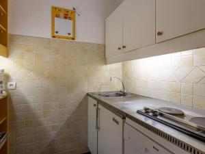 a kitchen with a sink and a counter top at Appartement Valmorel, 2 pièces, 5 personnes - FR-1-356-318 in Valmorel
