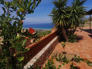 a view of the ocean from a house at Villa Verde in Cefalù