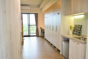Kuchyň nebo kuchyňský kout v ubytování Golden W Hotel