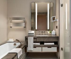 a bathroom with a sink, toilet, and bathtub at Address Istanbul in Istanbul