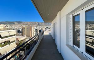 a balcony with a view of a city at Panoramic Cityscape Maisonette in Agios Dimitrios in Athens