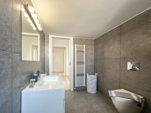 a bathroom with a sink and a mirror at Panoramic Cityscape Maisonette in Agios Dimitrios in Athens