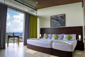 Rúm í herbergi á Nelinsa Resort and Spa