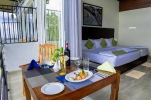 Rúm í herbergi á Nelinsa Resort and Spa