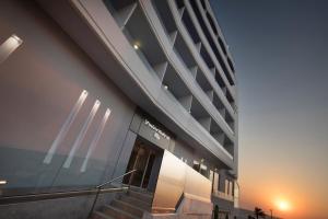 a building with a staircase in front of it at Rhodos Horizon Blu-Adults Only in Rhodes Town