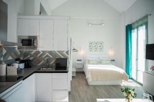 Kuchyňa alebo kuchynka v ubytovaní EM21 Apartamentos