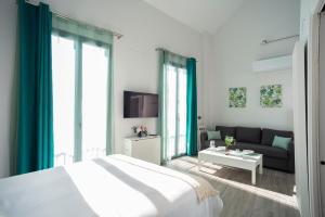 Posteľ alebo postele v izbe v ubytovaní EM21 Apartamentos