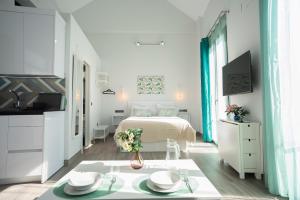 Posteľ alebo postele v izbe v ubytovaní EM21 Apartamentos