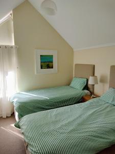 Giường trong phòng chung tại Cape View Villa- 74