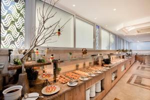 a buffet line with plates of food on display at Rhodos Horizon Blu-Adults Only in Rhodes Town