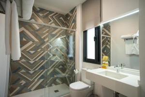 Kúpeľňa v ubytovaní EM21 Apartamentos + 17 fotografií