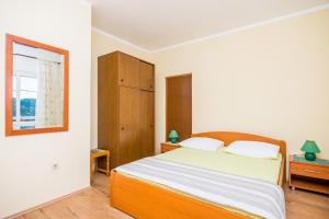 Cama o camas de una habitación en Apartments Violić