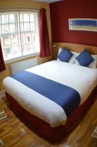 Postel nebo postele na pokoji v ubytování Ville Hotel