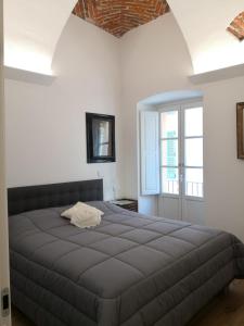 Ліжко або ліжка в номері Casa del Conte Massimiliano Roero