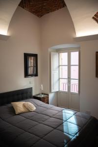 Ліжко або ліжка в номері Casa del Conte Massimiliano Roero