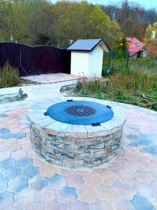 a fire pit in the middle of a patio at Villa Casablanca in Braşov