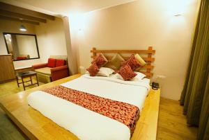 Postel nebo postele na pokoji v ubytování Hotel Maneck Residency + 5 fotografií