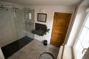 a bathroom with a sink and a shower at Fewo Kleine Münzenstraße 19 in Brandenburg an der Havel +38 photos