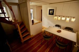 a room with a table and chairs and a staircase at Fewo Kleine Münzenstraße 19 in Brandenburg an der Havel