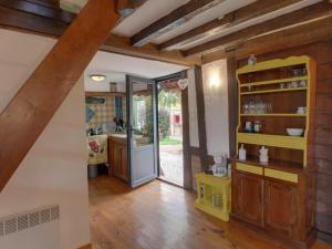 a kitchen with a door open to a dining room at Holiday village in Réclinghem +26 photos