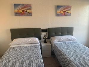 
Cama o camas de una habitación en Hostal El Perejil
