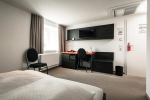 TV a/nebo společenská místnost v ubytování Hotel & Restaurant Ochsen Merklingen