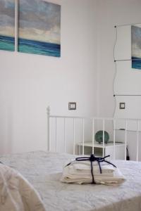 Postel nebo postele na pokoji v ubytování Uno Scorcio di Blu