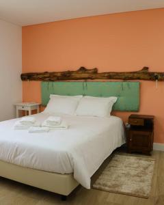 Säng eller sängar i ett rum på Ninho D'Arara