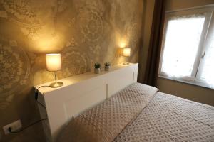 Postel nebo postele na pokoji v ubytování B&B 18 Gradini