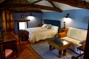 Posada Real El Rincón de Babia tesisinde bir odada yatak veya yataklar