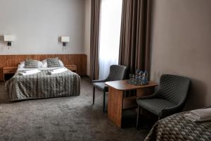 Postel nebo postele na pokoji v ubytování Hotel Jan Sander + 37 fotografií